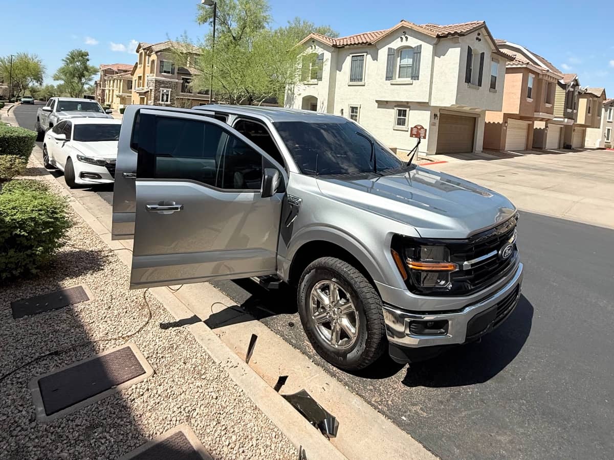 Gray Ford truck dark window tint